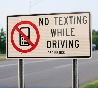 no texting while driving ordinance sign